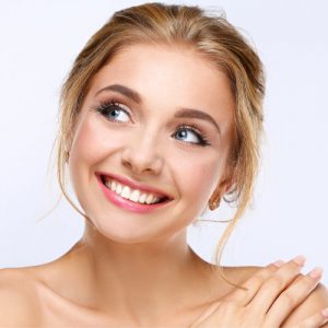 'woman smiling after receiving veneers'